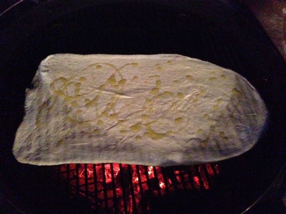 Drizzle EVOO on this side now & brush to coat then season with the salt, pepper, garlic salt and optional garlic herb blend. I suggest covering to both help the baking process & to minimize flames.