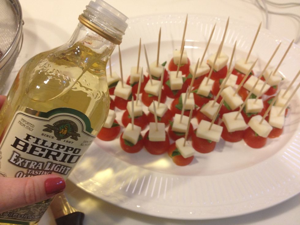 Drizzle olive oil across tomatoes.