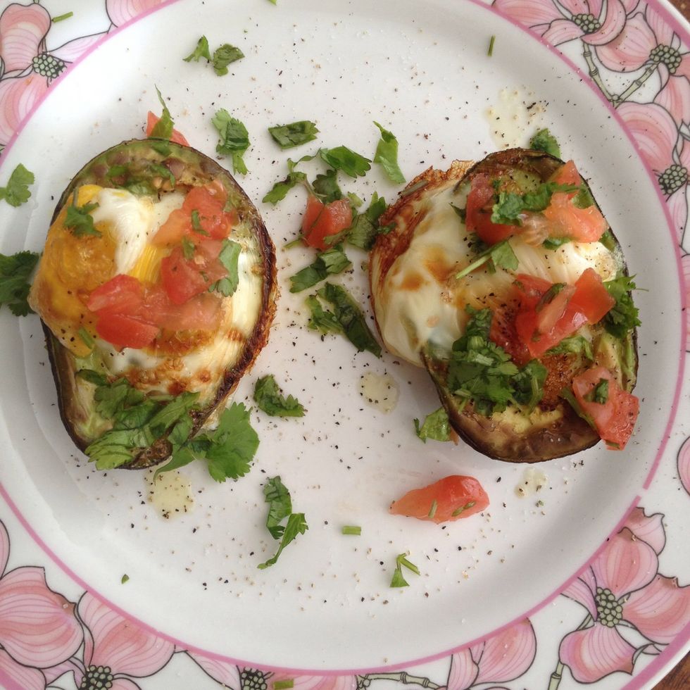 Drizzle olive oil, add salt, pepper, tomato, cilantro, and your sliced avocado. I like to include a pice of toasted pita for carbs...enjoy!