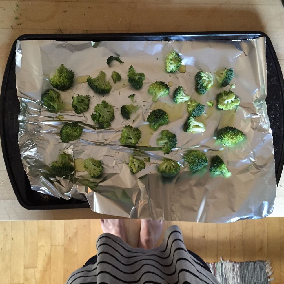 Drizzle olive oil over broccoli & add salt