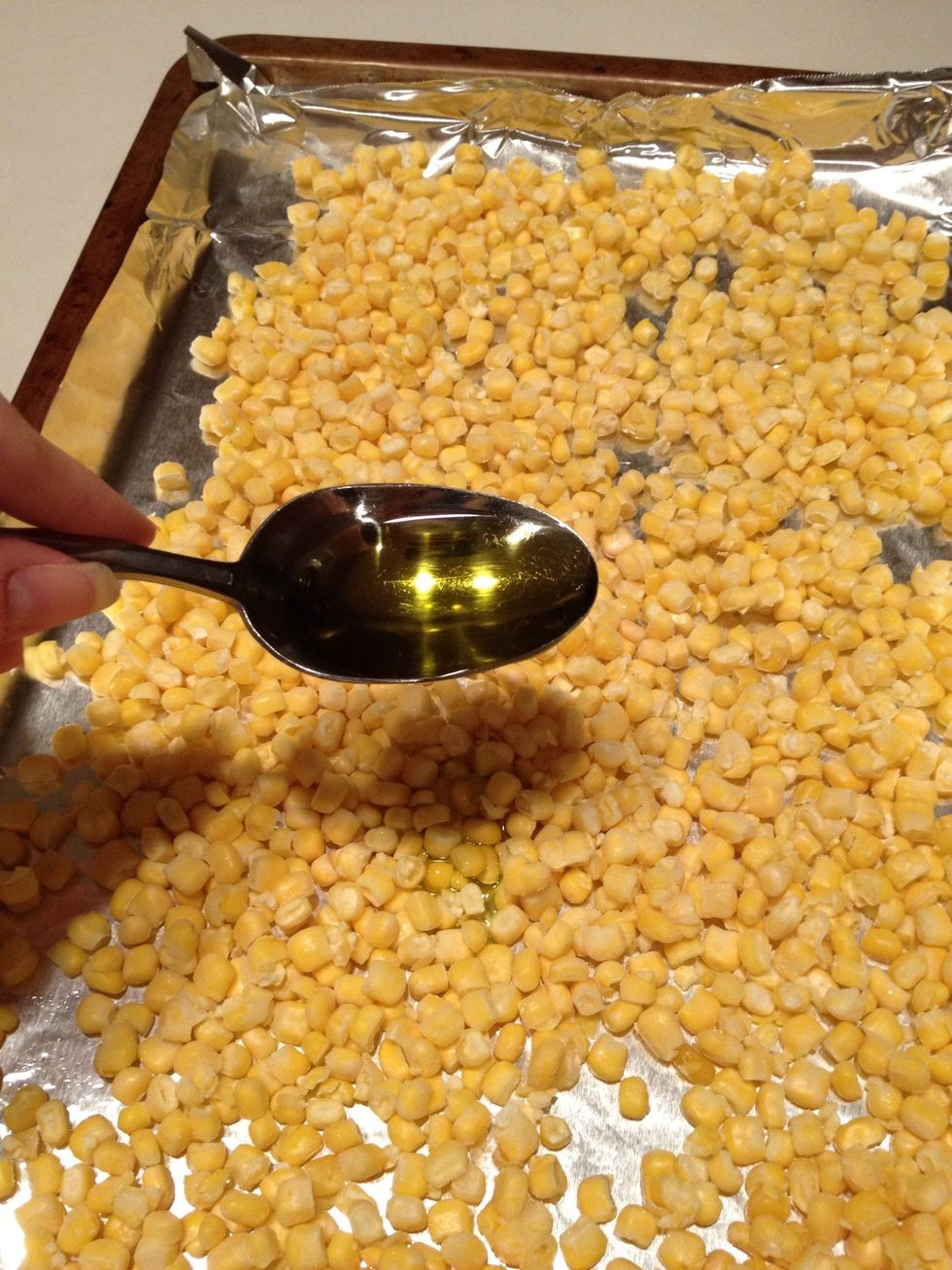 Drizzle olive oil over frozen corn. I used about 3 tablespoons then gently stirred the corn so it was well coated.