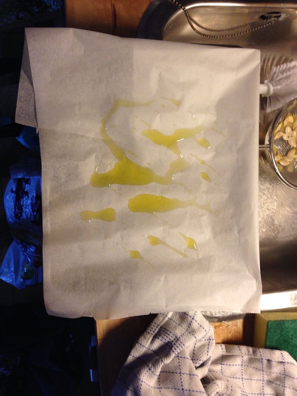 Drizzle some oil, I used olive oil, on a piece of parchment paper.
