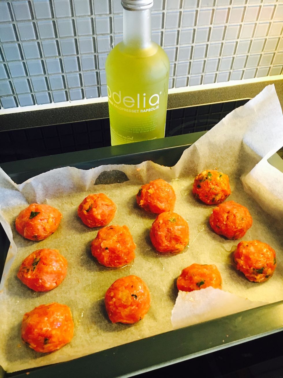 Drizzle some rapeseed oil on the baking tray. Roll mix into balls (Use tablespoon to measure the size) . Put in the oven (200 degrees celcius for 20-25 mins).