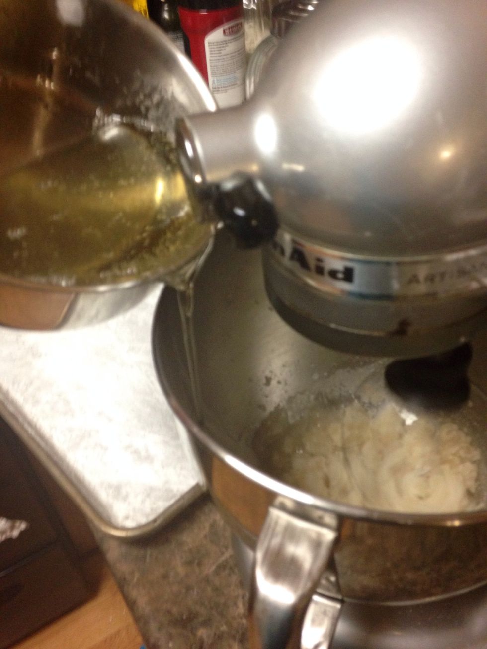 Drizzle sugar mixture down side of bowl. Do not get on the beater or on your hand unless you want a trip to the burn unit.