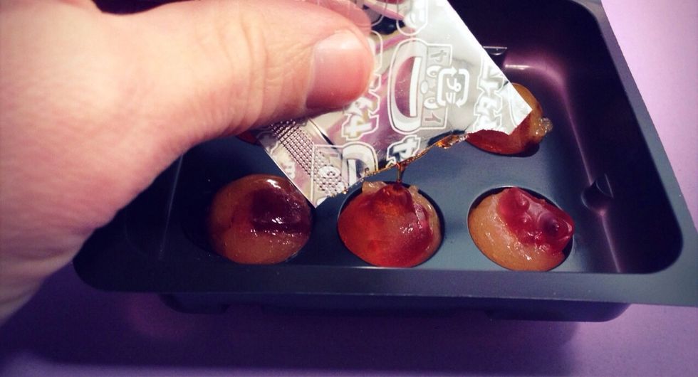 Drizzle syrup on Takoyaki