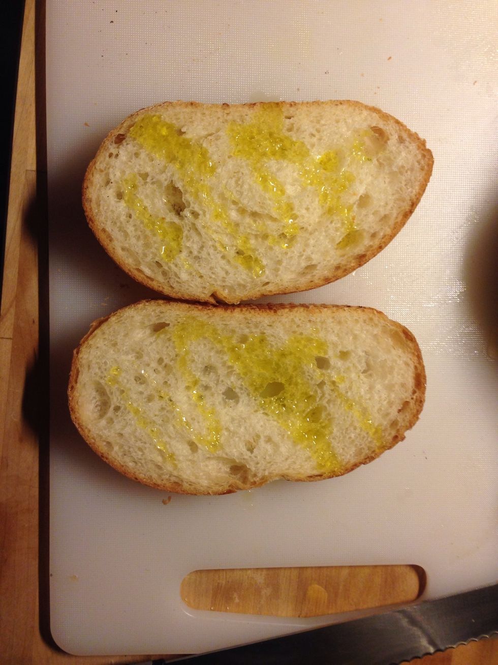 Drizzle the bread slices with olive oil, and put it in the oven. Take them out when they get brown and crisp.