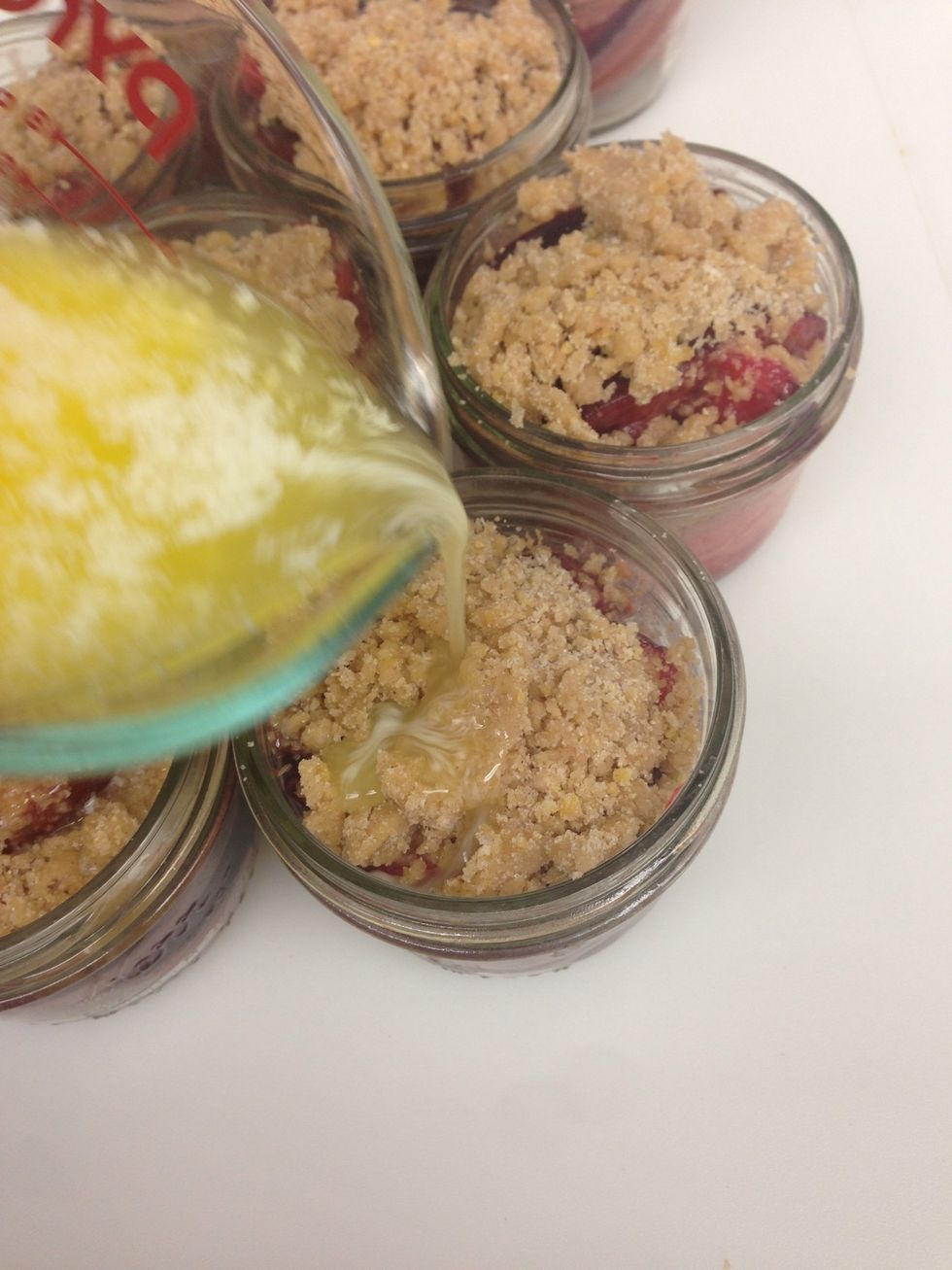 Drizzle the butter over each of the crumbles.