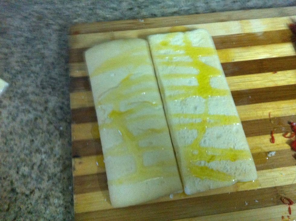 Drizzle the exterior side of the bread with the EVOO. About 1-2 TBSP