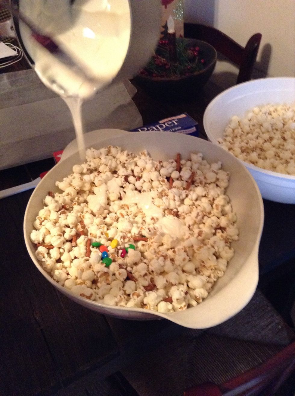 Drizzle the melted vanilla chocolate over top of the popcorn mix.