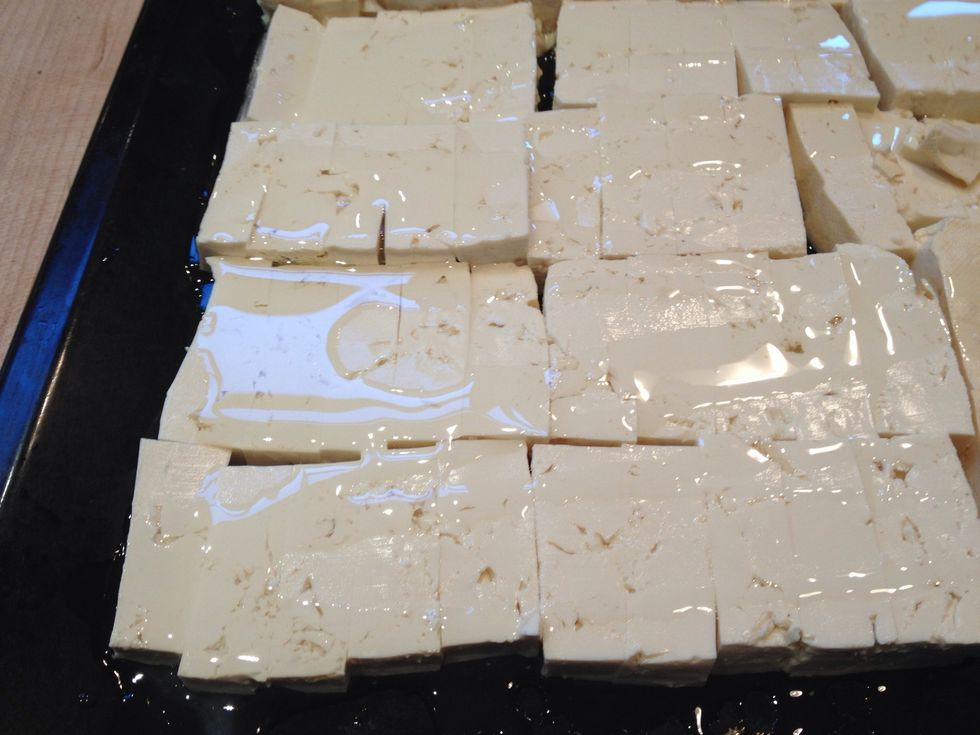 Drizzle the oil on the tofu. Enough to make it crispy, not so much that it is swimming in oil.