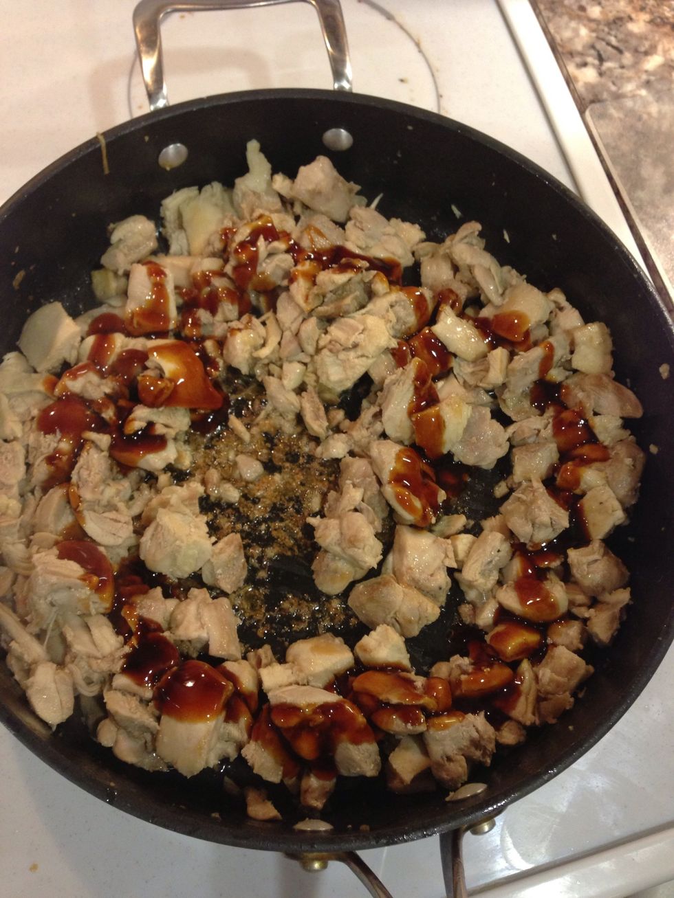 Drizzle the teriyaki sauce on to the meat and stir evenly