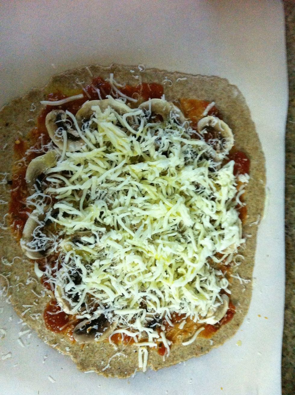 Drizzle with about a tablespoon of olive oil, I used garlic infused oil for more flavor! Allow it to rest for 45 minutes while the pizza stone is pre heating