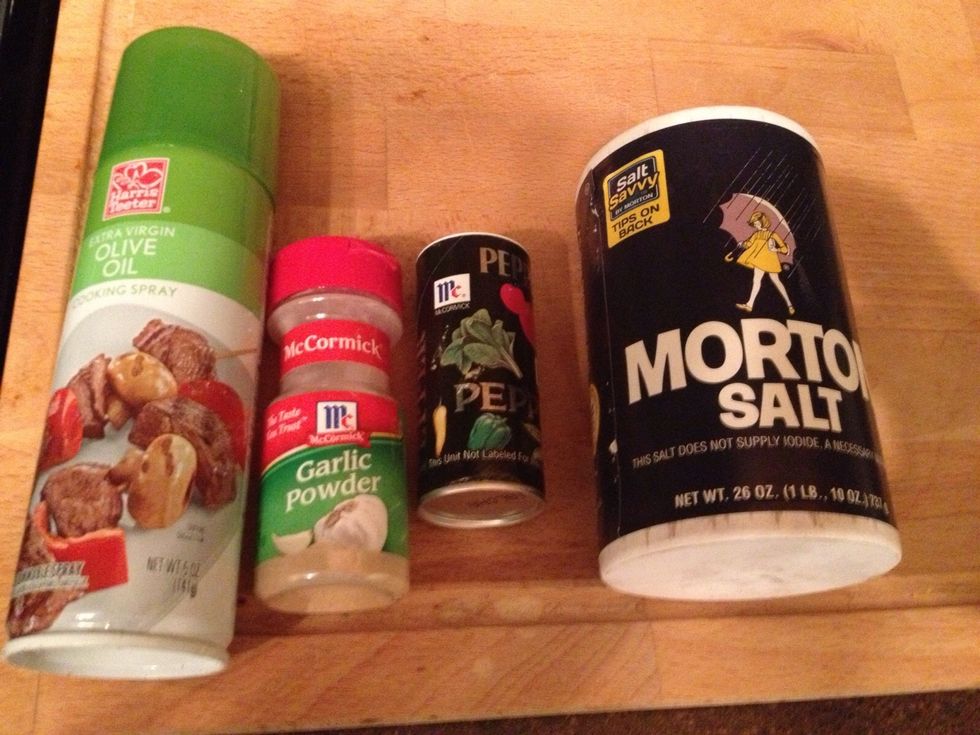 Drizzle your Olive Oil (spray shown) and sprinkle your Garlic Powder, Salt and Black Pepper onto your Kale.