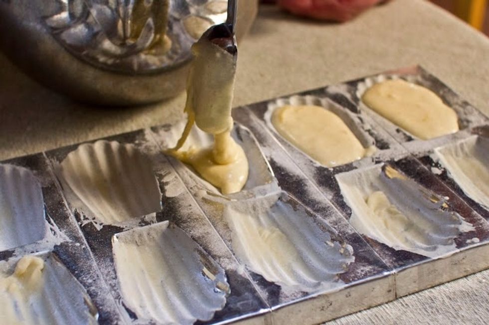 Drop 1 Tbs of batter into each mold.