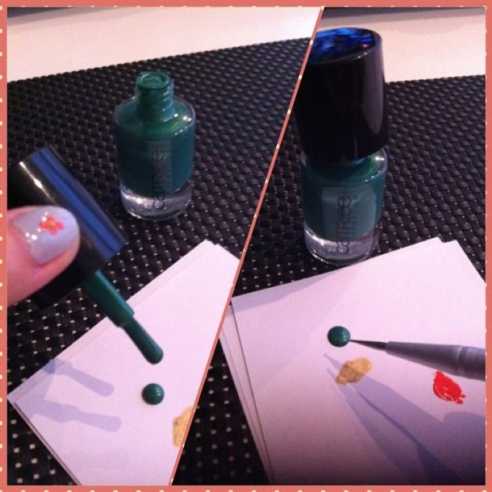 Drop a blob of the green colour on a piece of paper. Use dotter to dip into it.