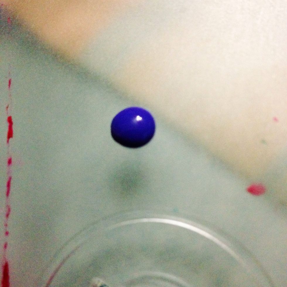 drop a dab of polish the opposite color of the background polish. i used a cd cover but you can use a paper towel.