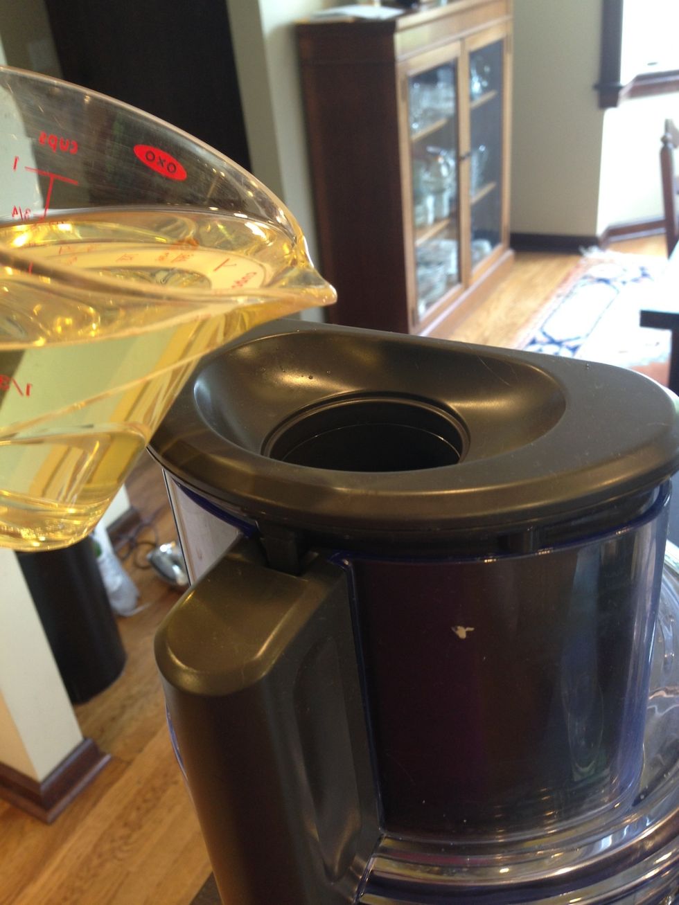 Drop by drop, mix in 1 cup olive oil, whisking constantly.