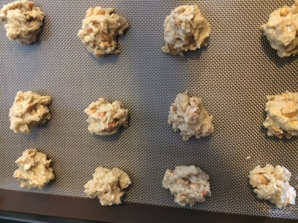 Drop by rounded spoonfuls 2 inches apart on parchment paper - I use a permanent one that can be washed and reused Bake @ 375 degrees for 8-10 minutes or until lightly browned - cool on wire rack