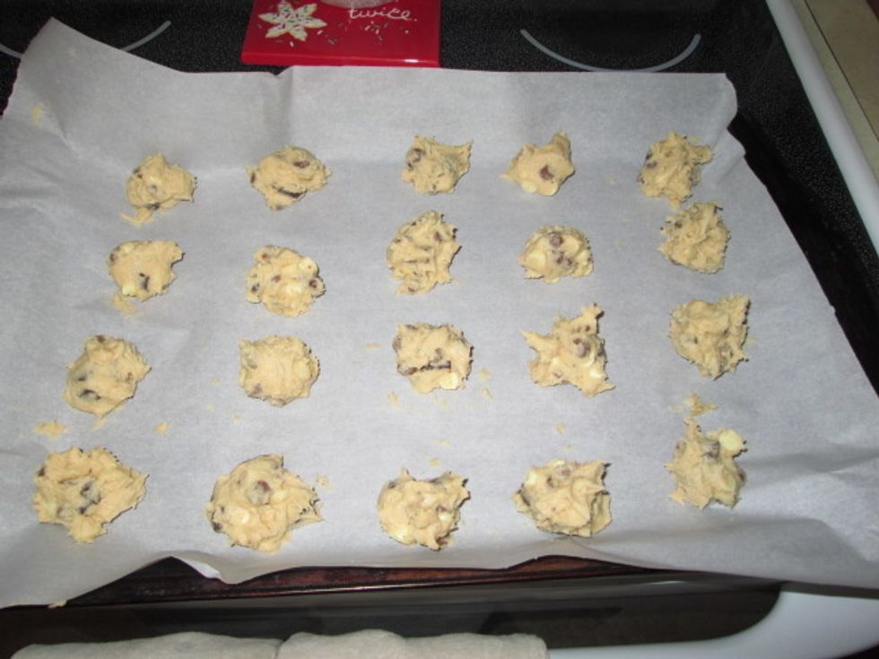 Drop by tablespoon sized balls. Bake at 350 degrees Fahrenheit for 12 minutes. Makes about 3 dozen.