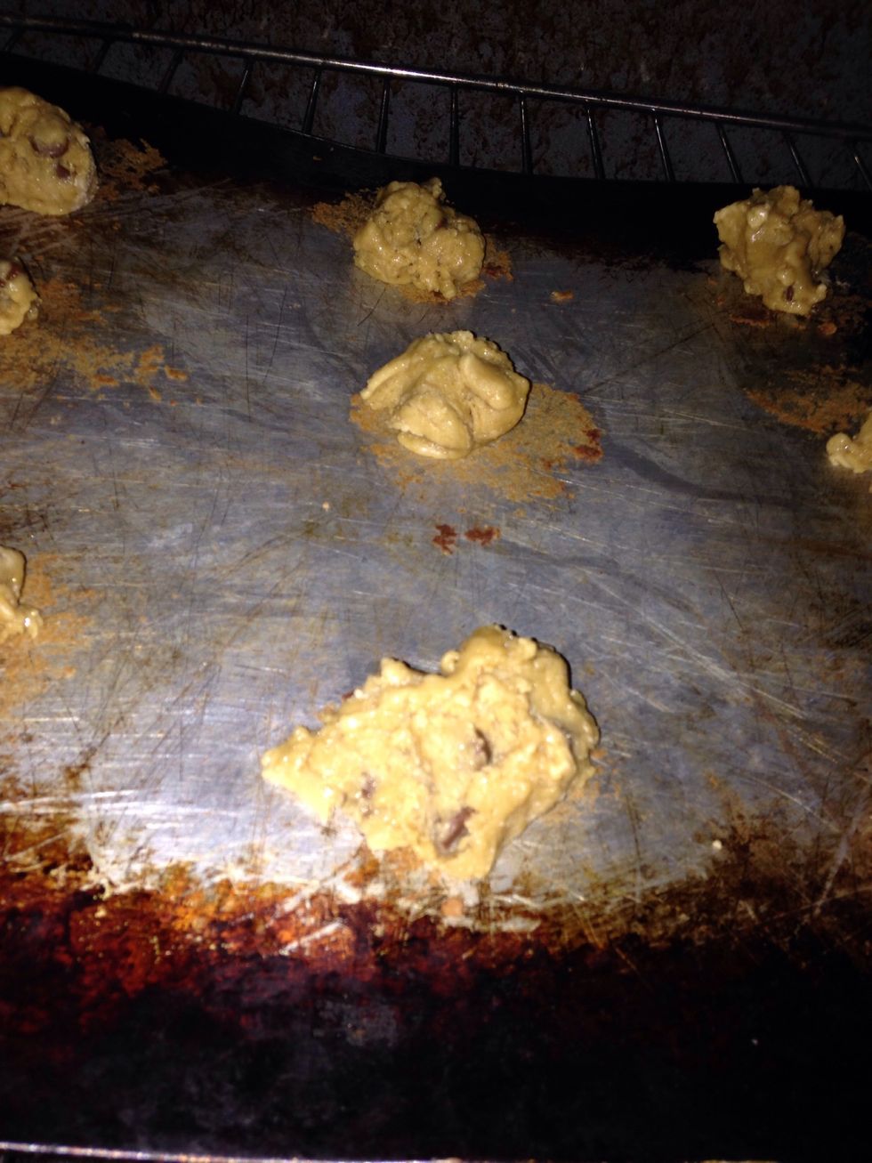 Drop dough by spoonfuls on cookie sheet Bake in a preheated oven of 350 and bake till brown around sides (if they flatten take dough and add extra cup of flour. This is for higher altitudes)