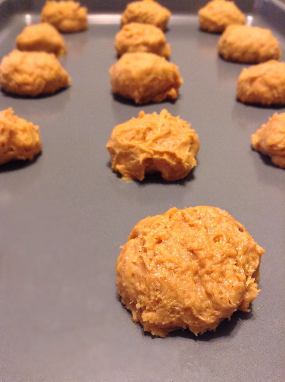 Drop dough by the tablespoon two inches apart on an ungreased sheet. Bake for 12-13 minutes :)