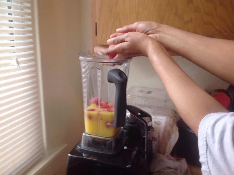 Drop in your handful of strawberries *side note as you may or may not want to chop the strawberries depending on the type of blender you have EX. Vitamix you don't' need to chop before hand