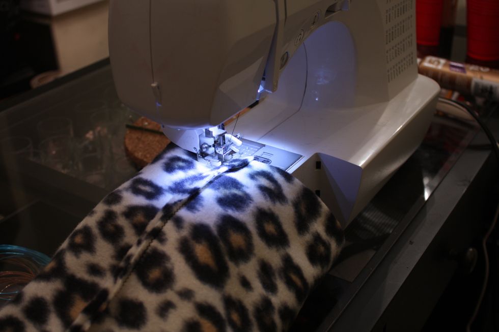 Drop in your machine, and using the same small zig zag-stitch it up. Don't get crazy though... read the next step before you start!