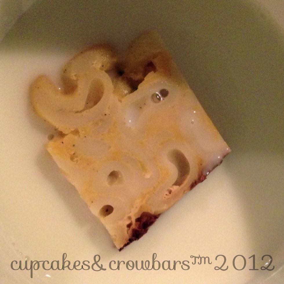 Drop it into the milk, just to wet it.