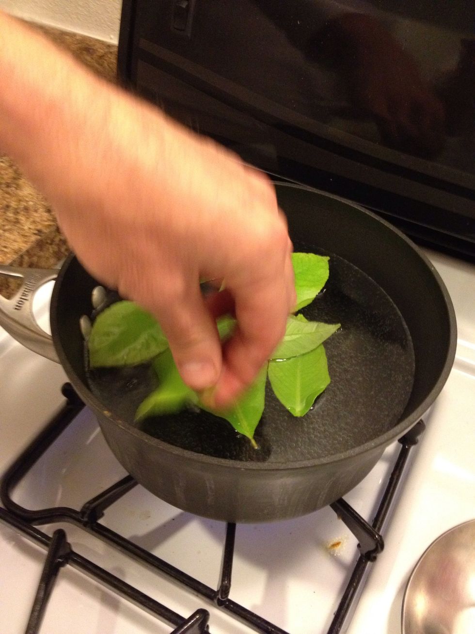 Drop leaves in boiling water