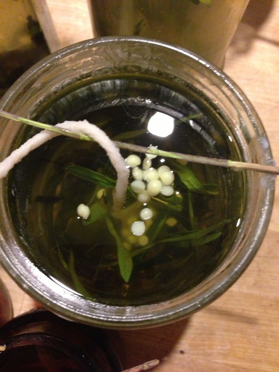 Drop pearls in wax while warm enough that wax is liquidy, but not hot enough to melt the beads.