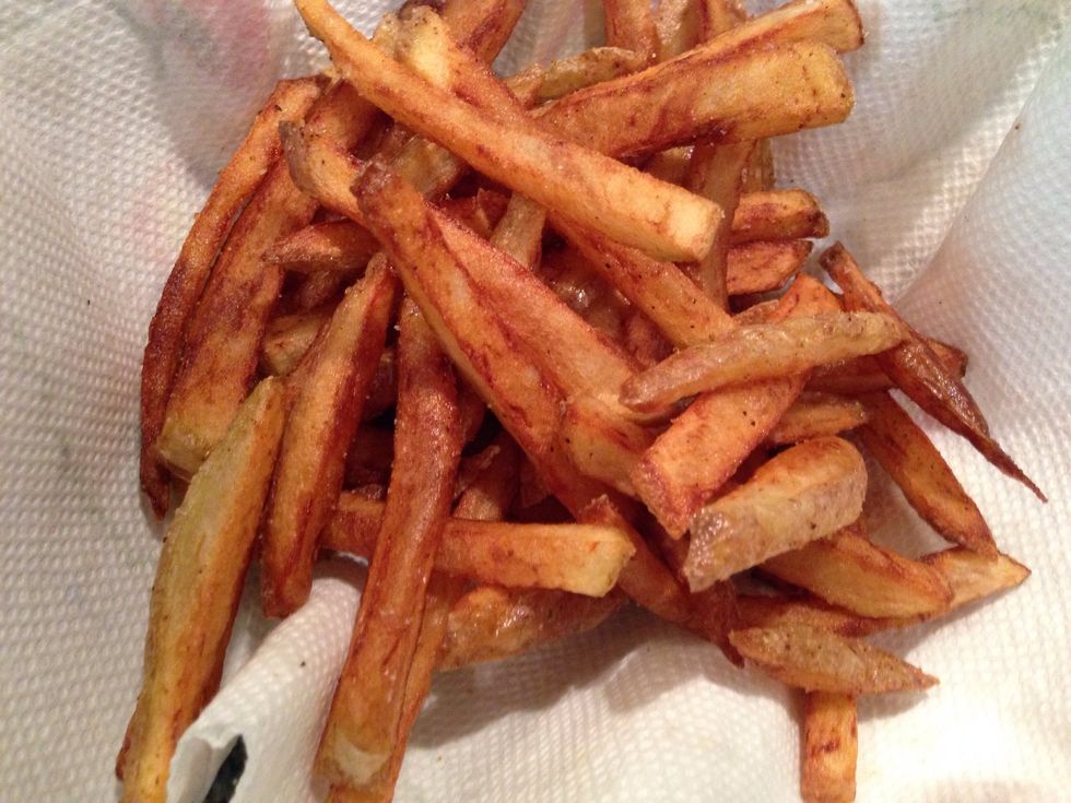 Drop the fries back in the oil and crisp them up. Double fry is how to really get them crispy. Season with salt , fresh herbs if u like, or seasoned salt.