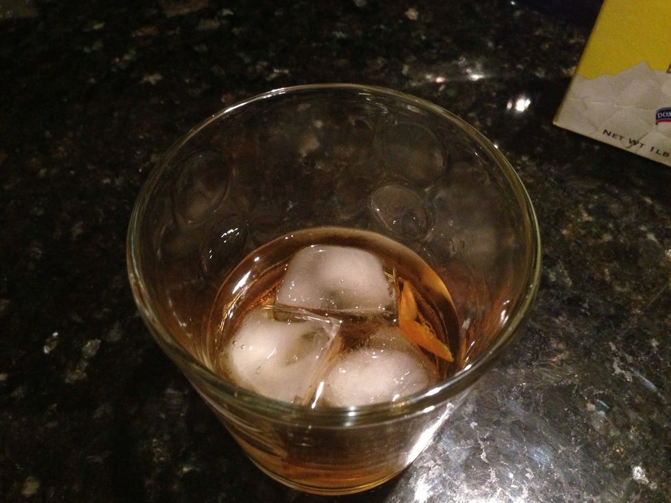 Drop the peel into the glass and give it a good whirl !