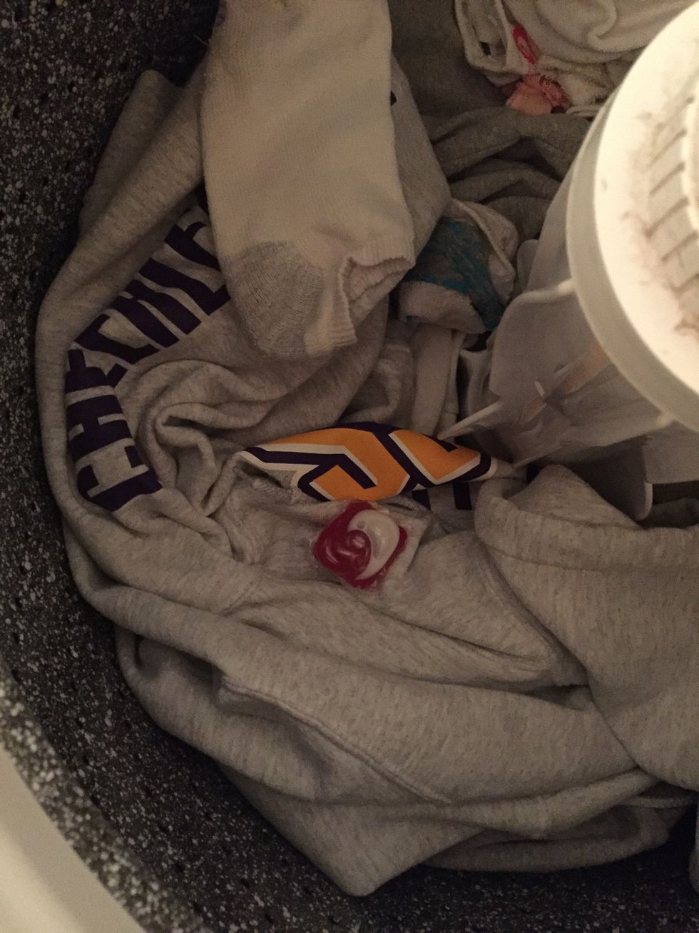 Drop the pod in after you put the clothes in.