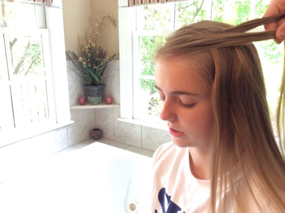 Drop the strand that is in front and let it rest against your head. This will begin the waterfall part of the braid.