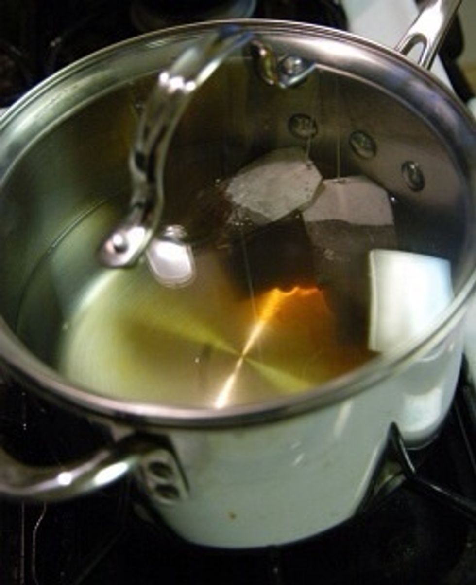Drop the two tea bags into the water and remove from heat. Cover with a lid and allow steeping for at least 1 hour.