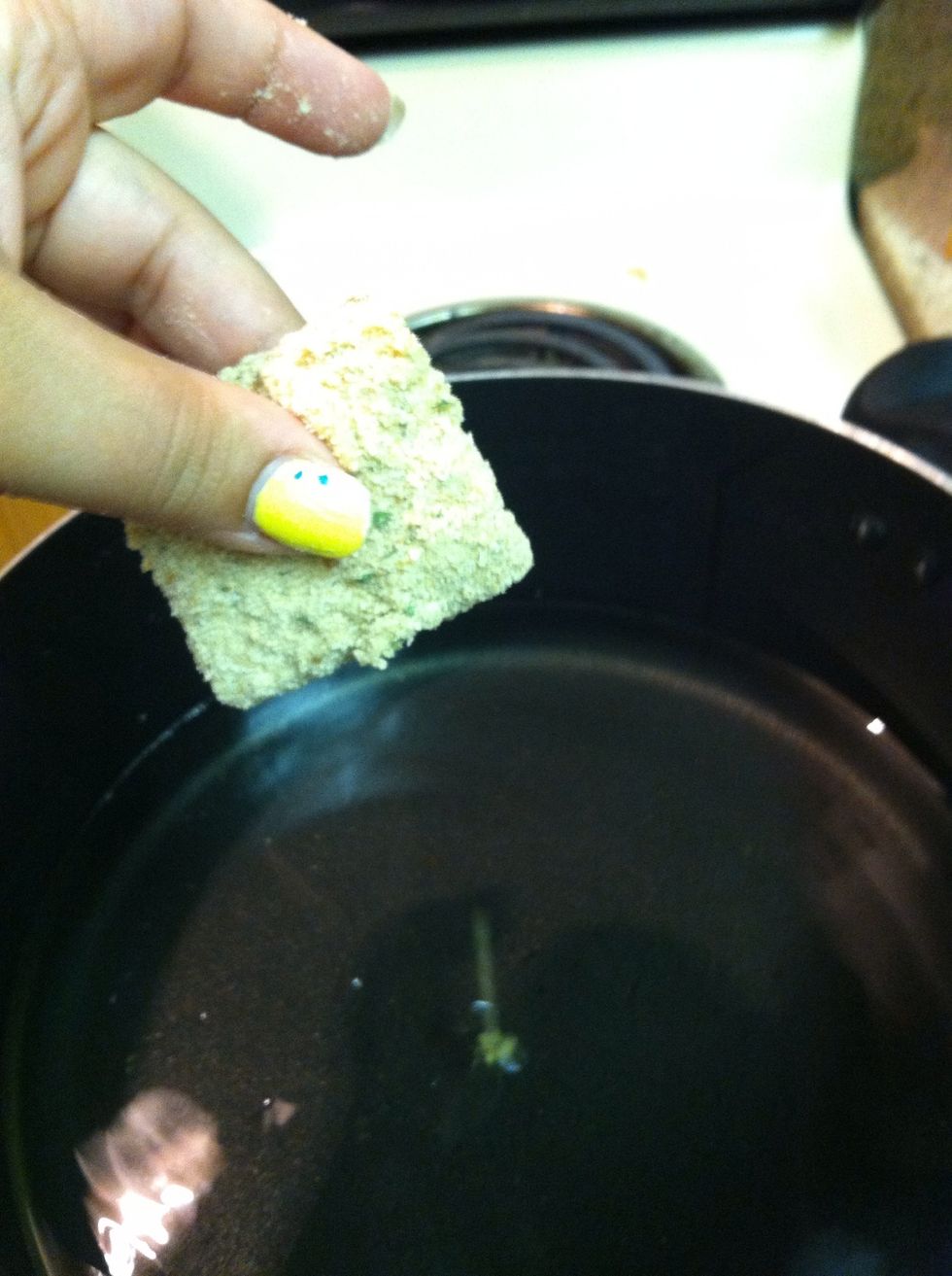 Drop then carefully into the hot oil. To check if its hot enough, dip your fork into the egg mix and let a little droplet fall into the oil, if it bubbles up its ready.