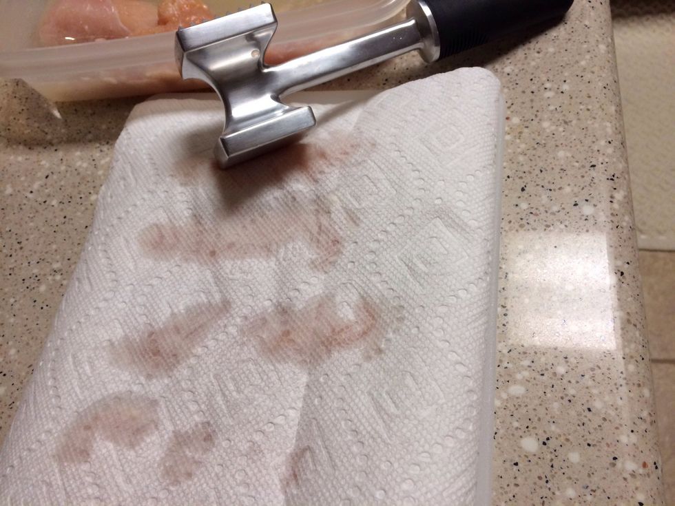 Dry and pound thick part of chicken with a meat tenderizer till they are about the same thickness