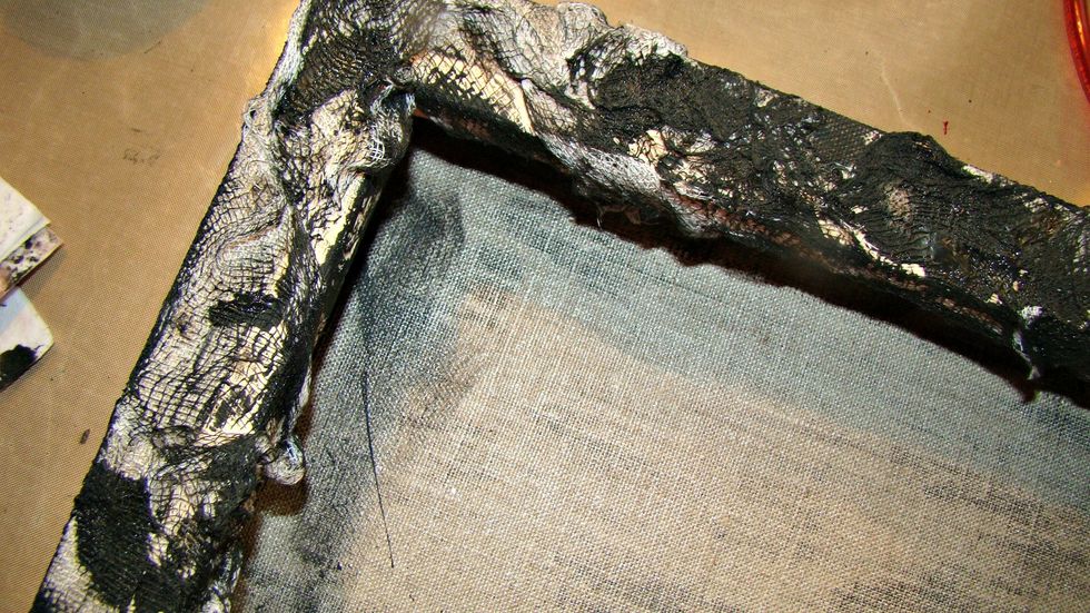 Dry brush AA Velvet in Tuxedo all over the outside and frame of the canvas.