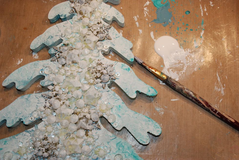 Dry-brush gesso on top of the embelishments.