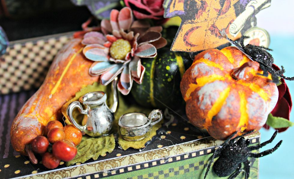 Dry brush Titan Buff paint randomly on pitcher, cup, flowers, pumpkins, etc.