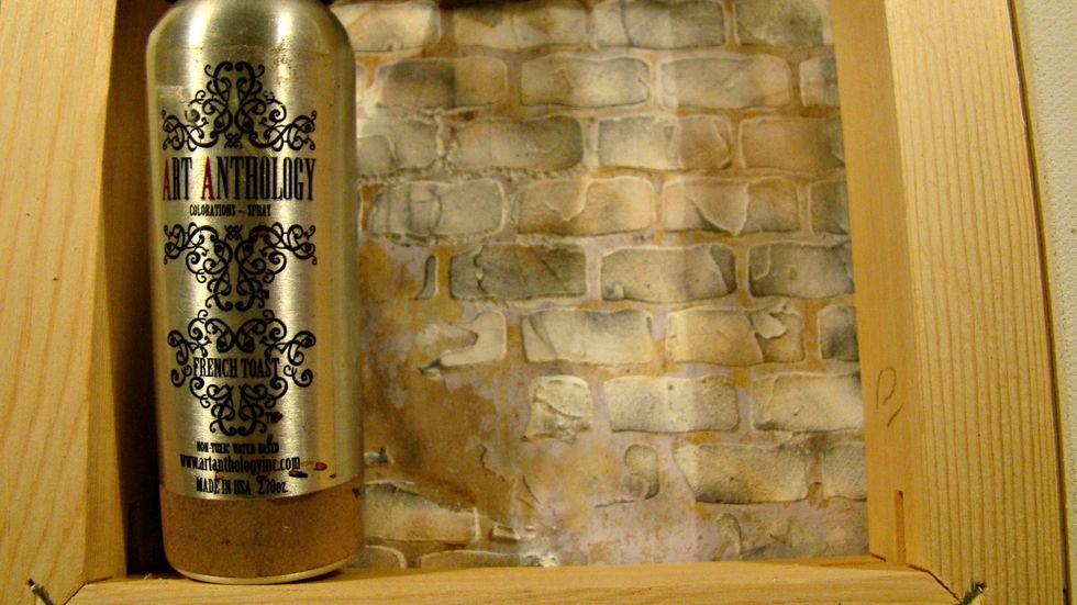 Dry brush your black leather jacket here and there on your bricks and spritz with water. Then using  Coloration French Toast spray the bricks and blot with paper towels.