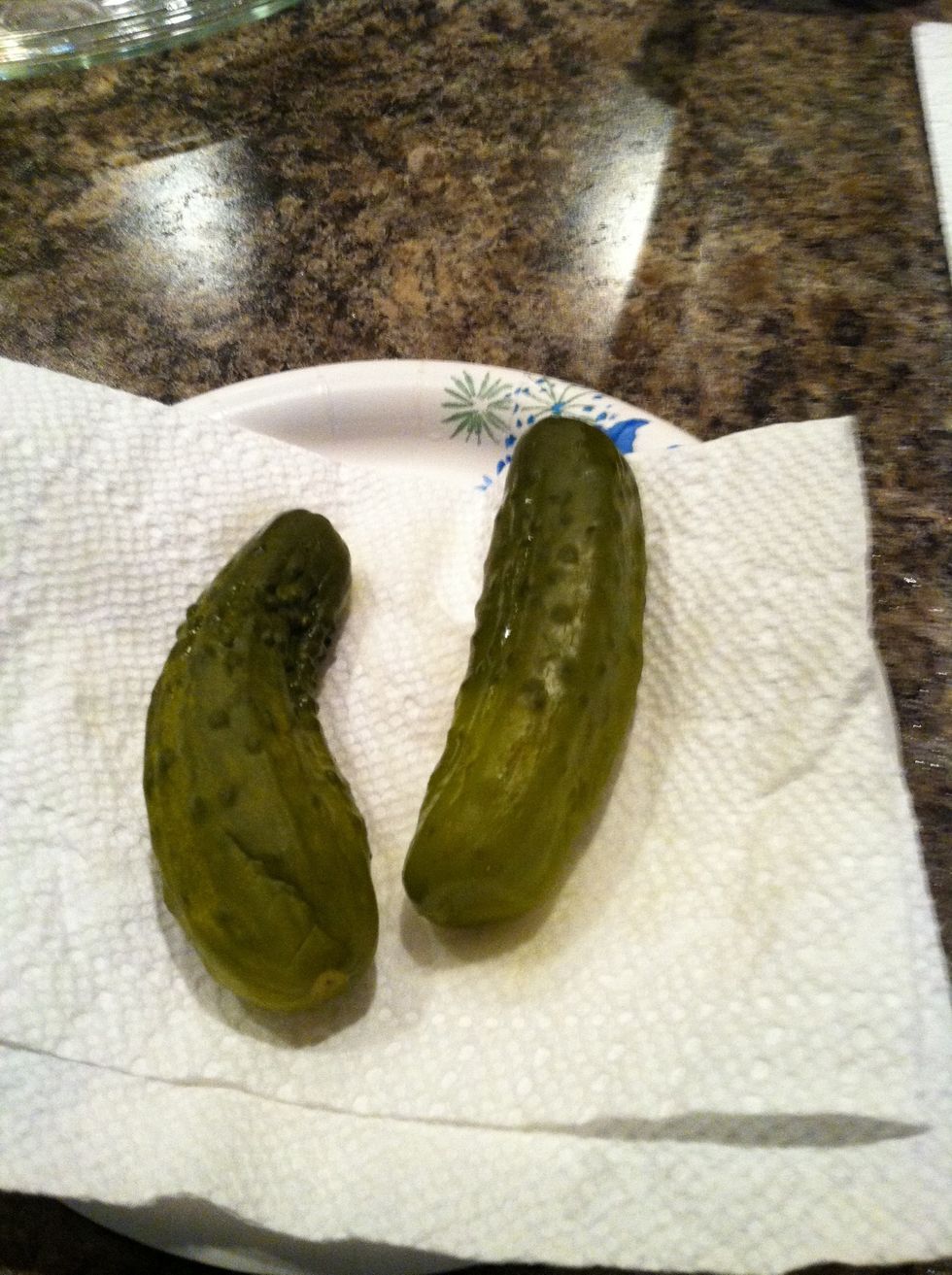 Dry excess pickle juice off pickles.