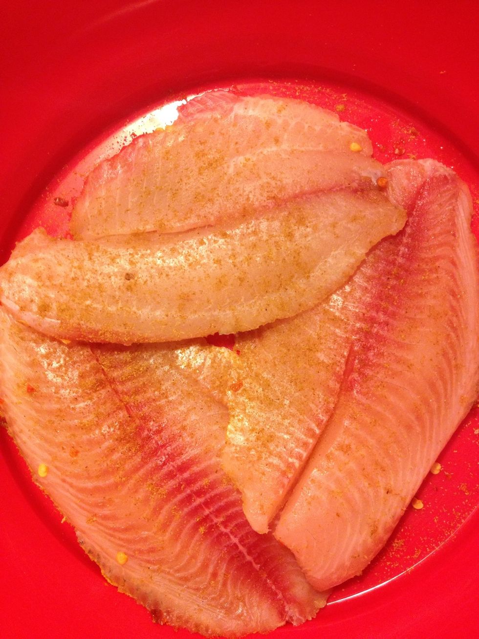 Dry fillets using paper towel; add in cumin, salt & a squirt of lemon.