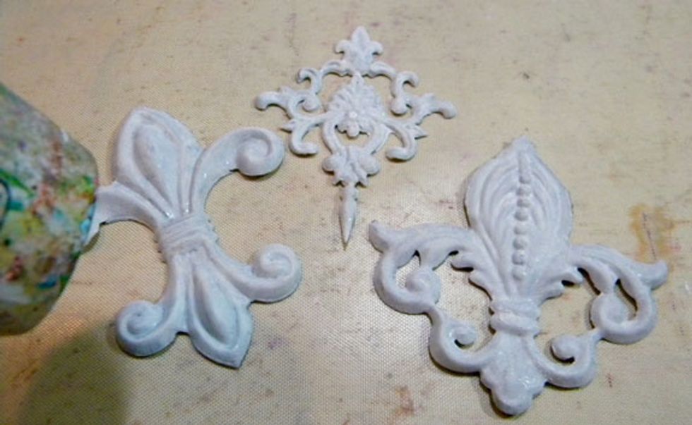Dry them using a heat tool till they are really hot, but be careful not to burn yourself! I wanted the gesso and Cotton to be "baked" on.  I wanted to see if I could get the paint to crackle a bit.