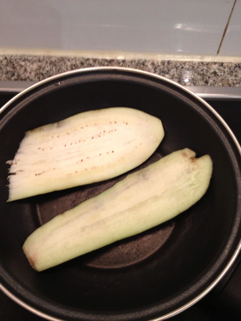 Dry them with a paper and grill them to soften (no oil needed)