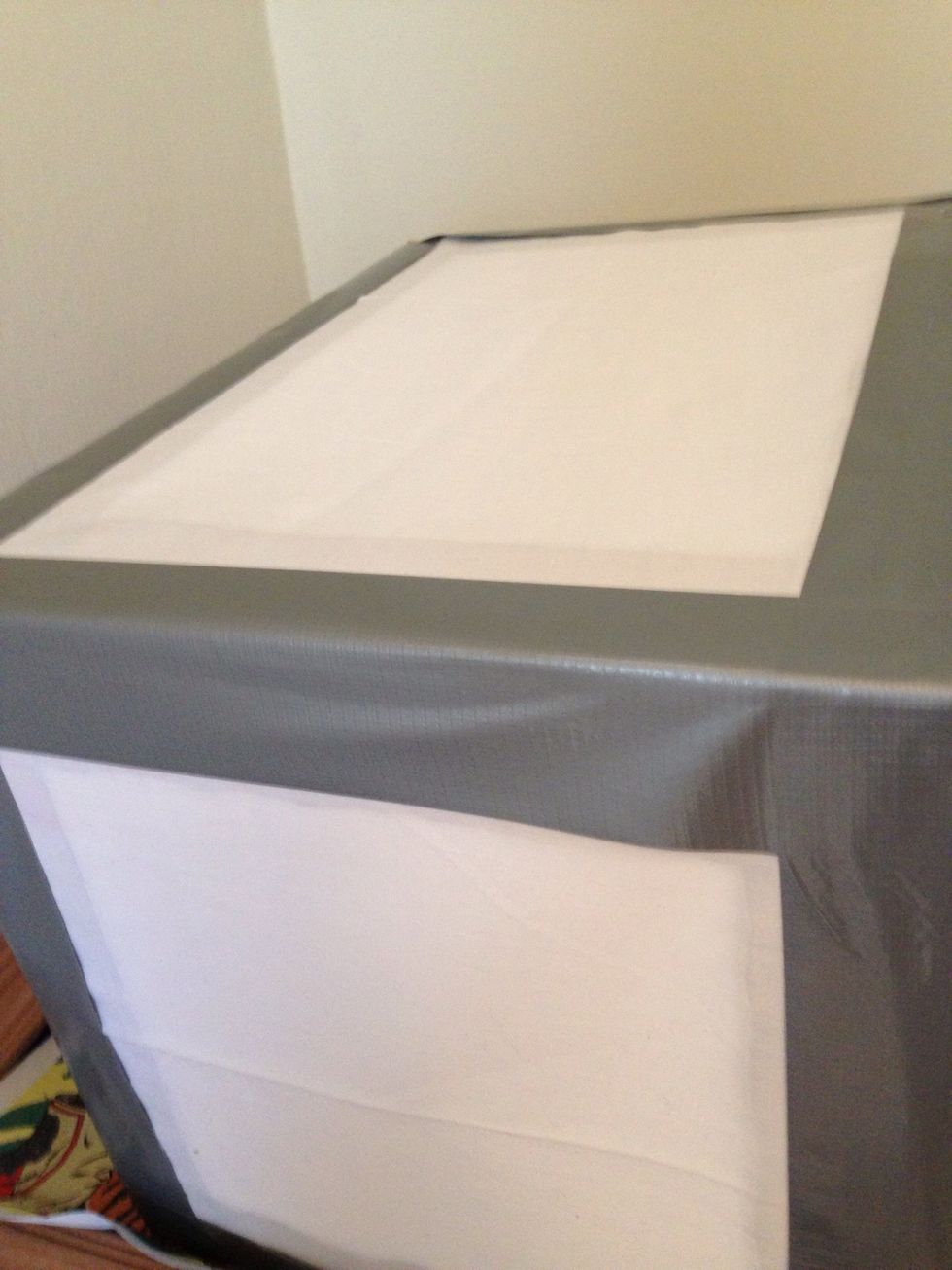 Duct tape your fabric over the open holes you cut. Try to stretch the fabric so it's nice and taut.