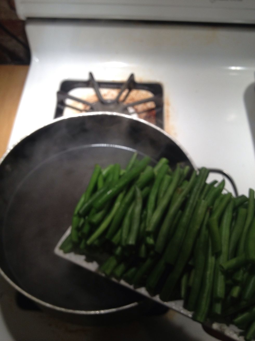 Dump beans into salted boiling water.