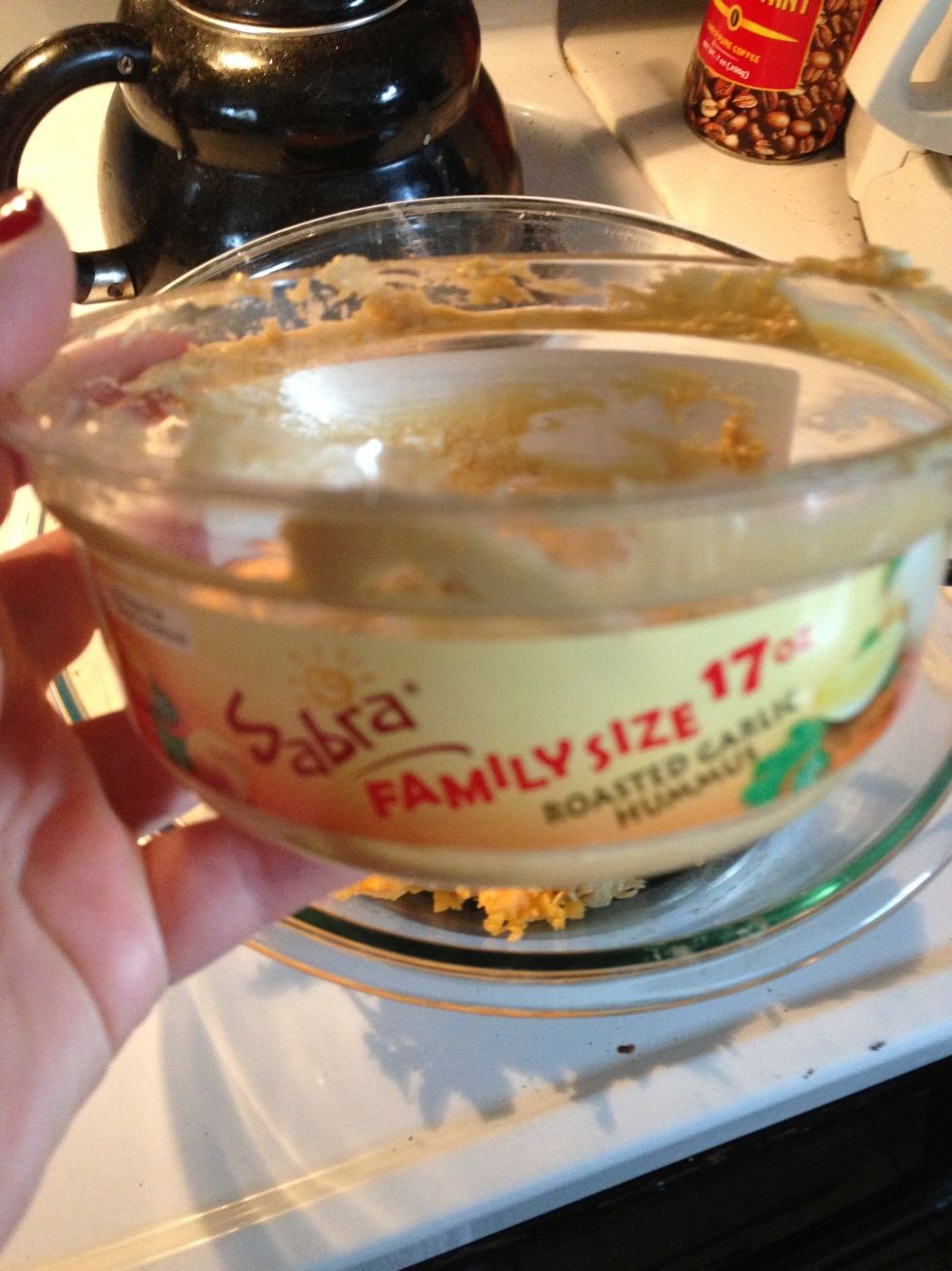 Dump hummus into a large bowl.