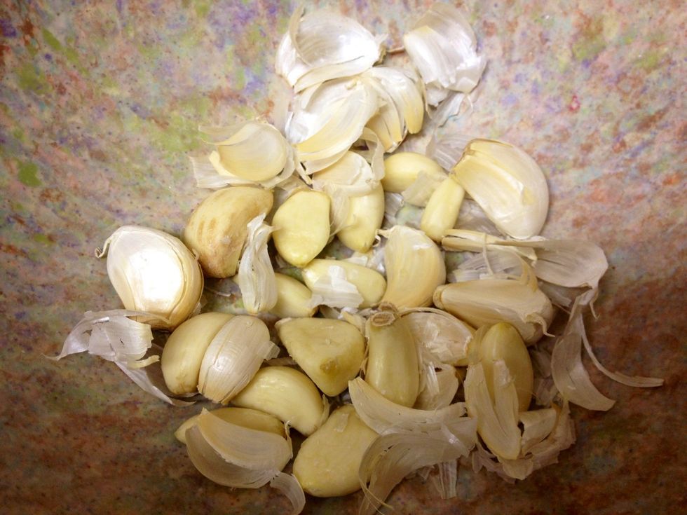 Dump into a bowl and pick out your peeled cloves. I think out of 2 heads of garlic I had 4 cloves that didn't peel completely but the skins were quite loose and came off very easily.