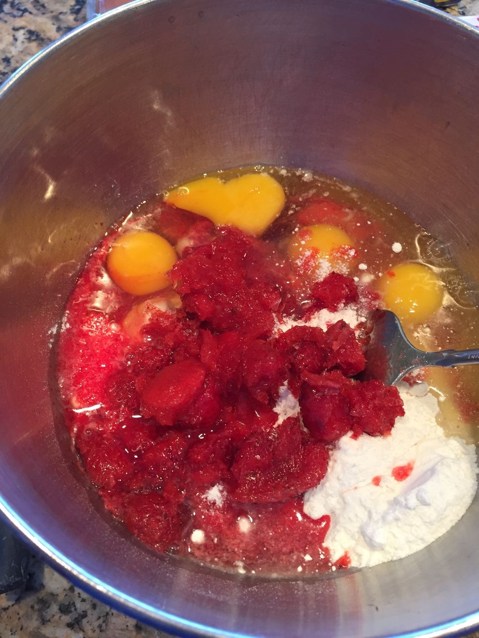Dump it all in: the eggs, and the jello mixture. To this I add about half a container of frozen strawberries (and juice, thawed)